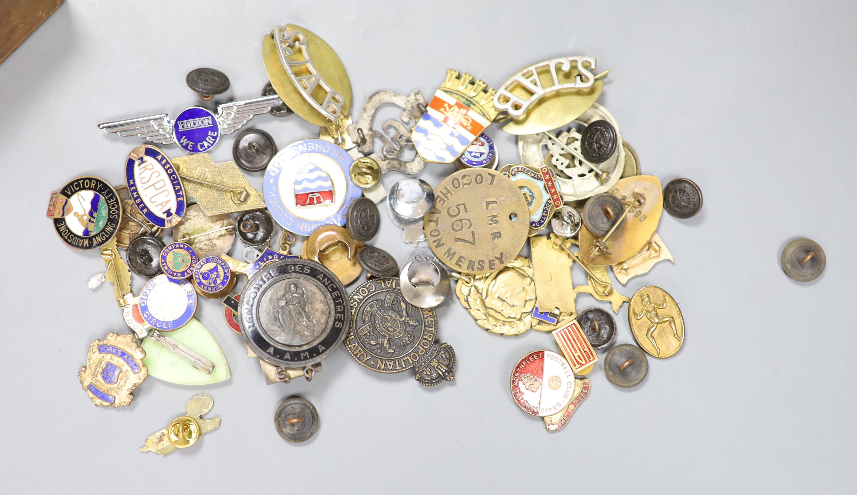 A quantity of enamelled badges and buttons